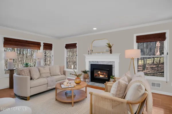 a living room with furniture and a fireplace