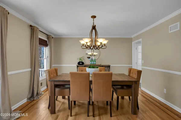 a view of a livingroom with furniture and hardwood floor