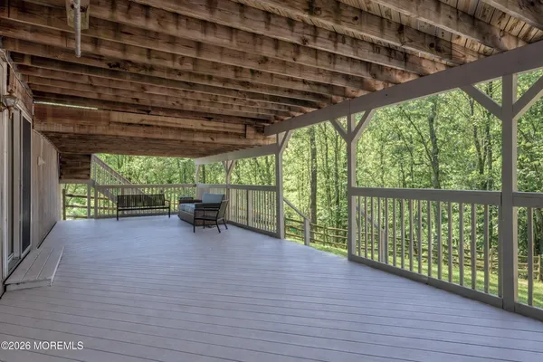 a bathroom with a sink toilet and a mirror