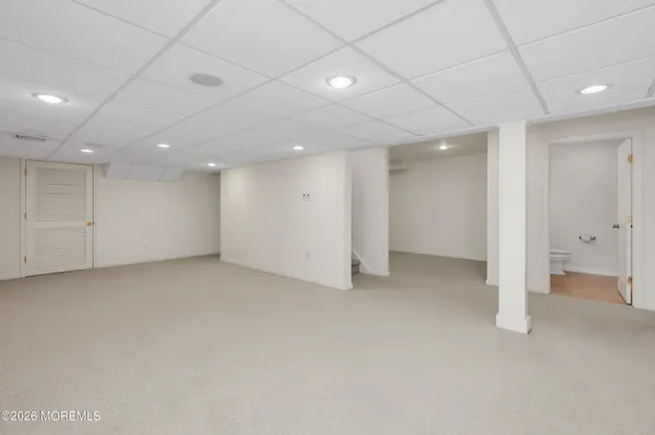 a bedroom with double bunk beds and a ceiling fan