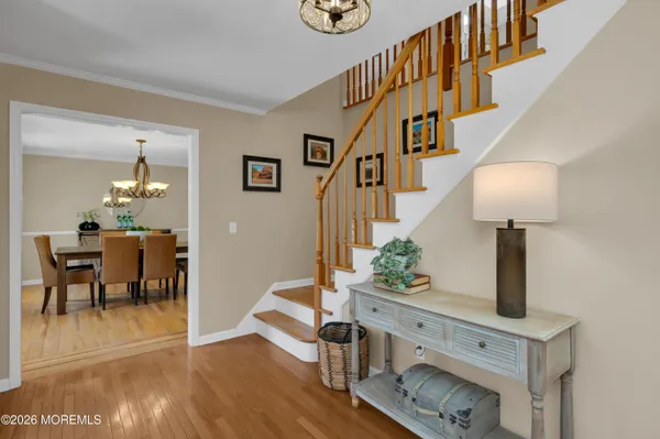 a view of hall way with furniture and staircase