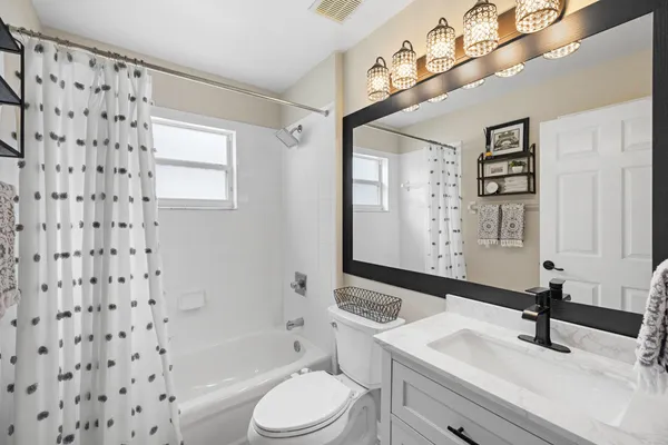 a view of a swimming pool with a lounge chair