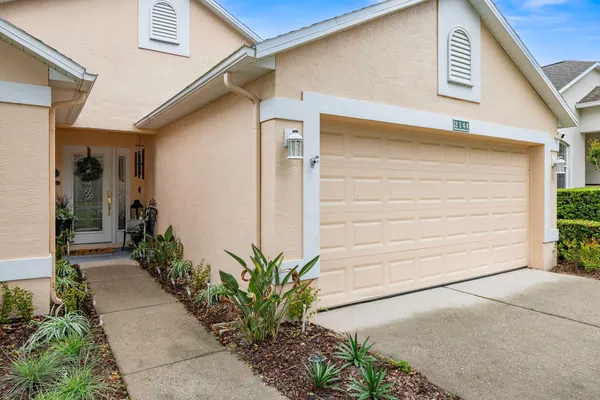 a view of a dining room with furniture and a kitchen