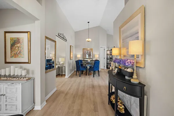 a living room with furniture and a book shelf