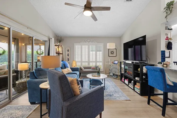 a kitchen with stainless steel appliances granite countertop a refrigerator and a stove