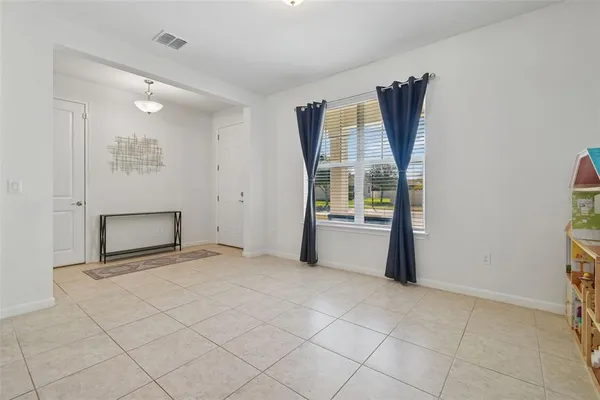 a kitchen with granite countertop wooden cabinets a refrigerator a stove a sink and a oven