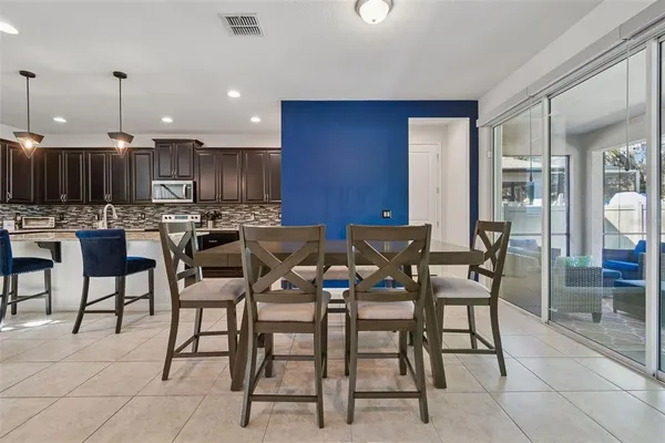 a bed room with a bed and a chandelier
