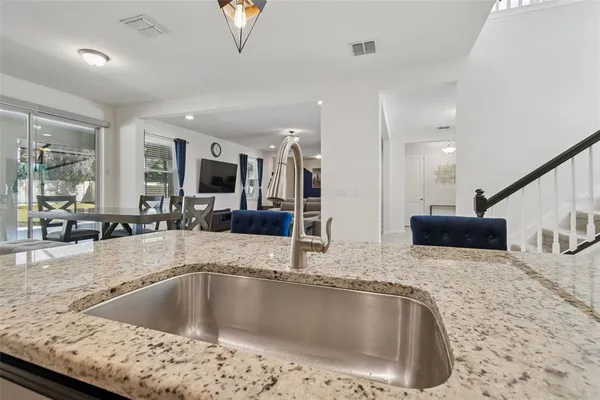 a bathroom with a double vanity sink and mirror