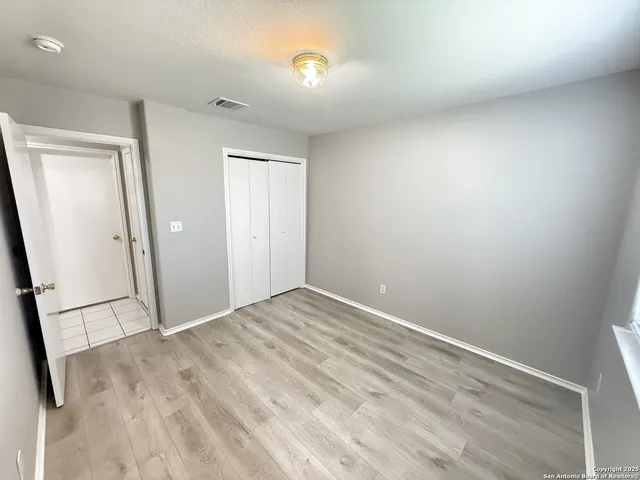 an empty room with mirror