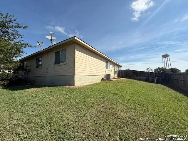 a house view with a backyard space