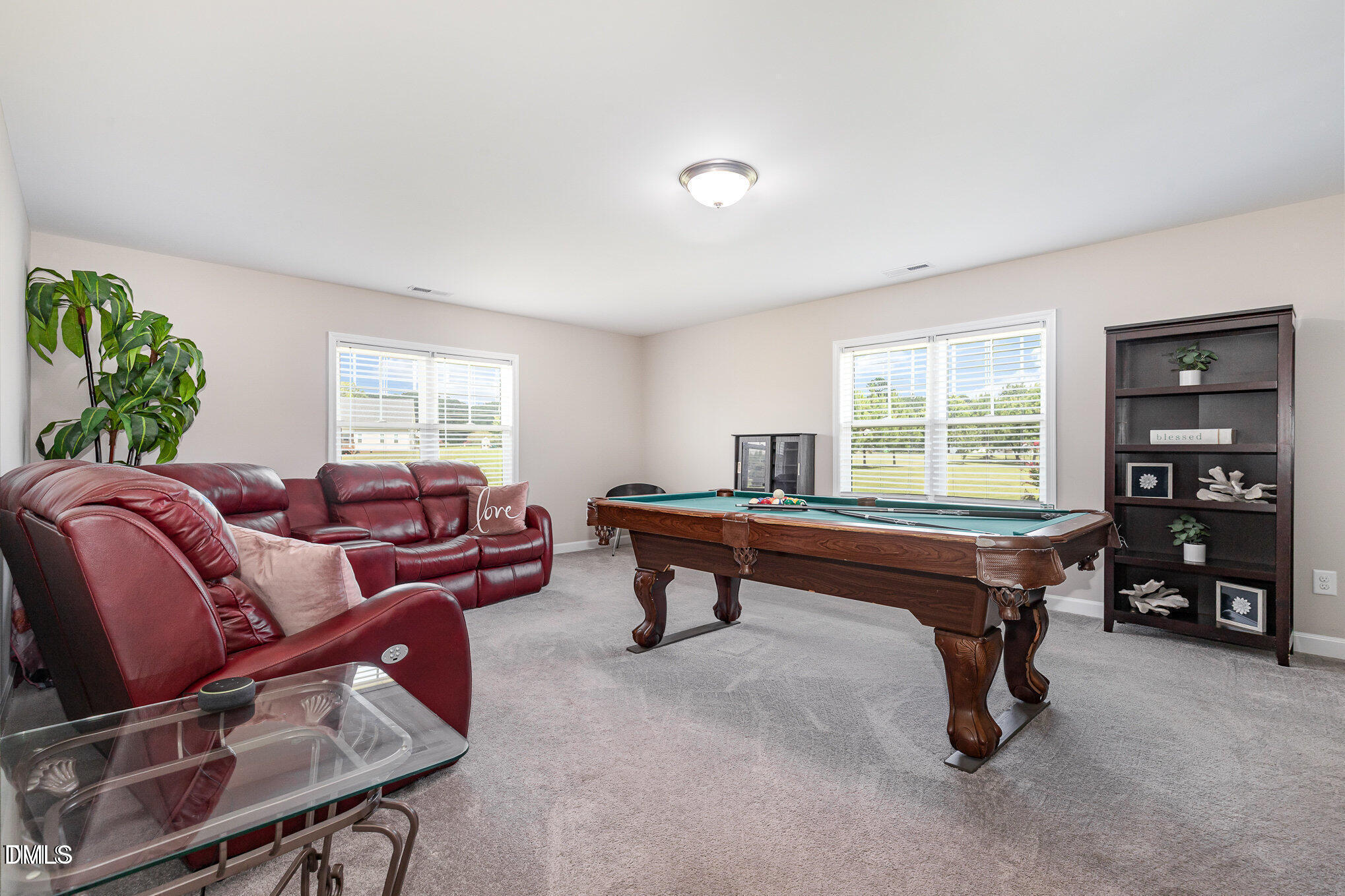 8662 Buckhorn Plantation Road Sims, NC 27880 - Photo 21 of 37 a living room with furniture a window and a flat screen tv