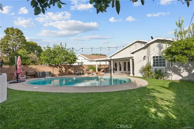a view of a house with a yard porch and sitting area
