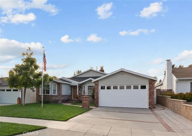 a house with garden in front of it