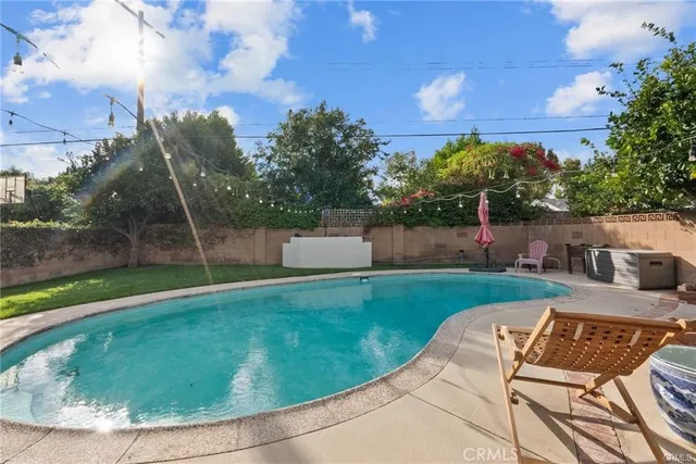 a view of a backyard with sitting area