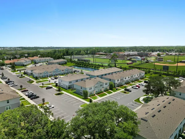 an aerial view of a city with lots of residential buildings