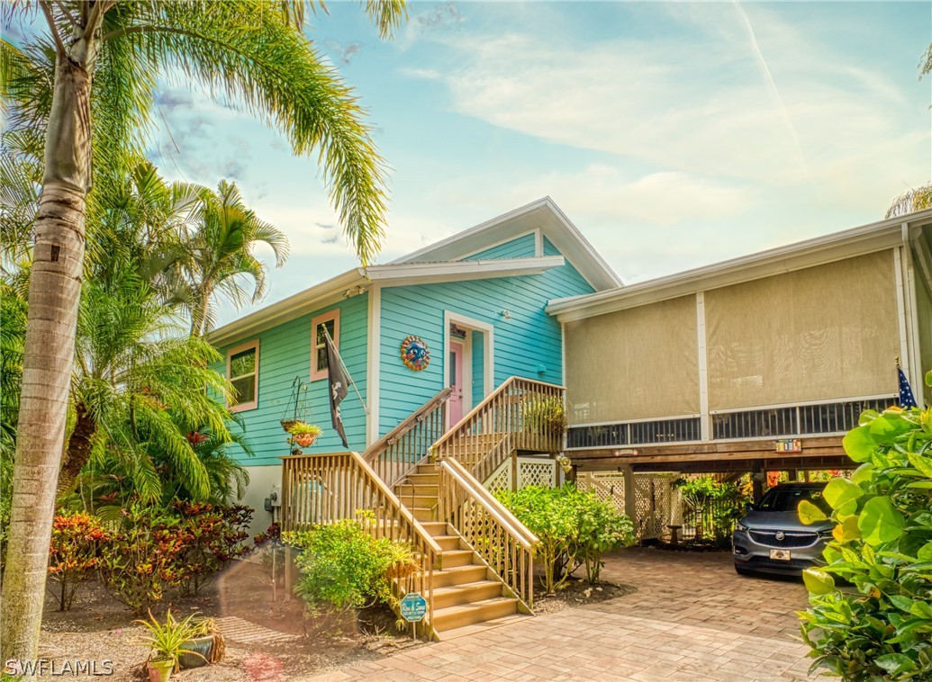 1186 Sand Castle Road Sanibel, FL 33957 - Photo 1 of 24 a house view with a backyard space