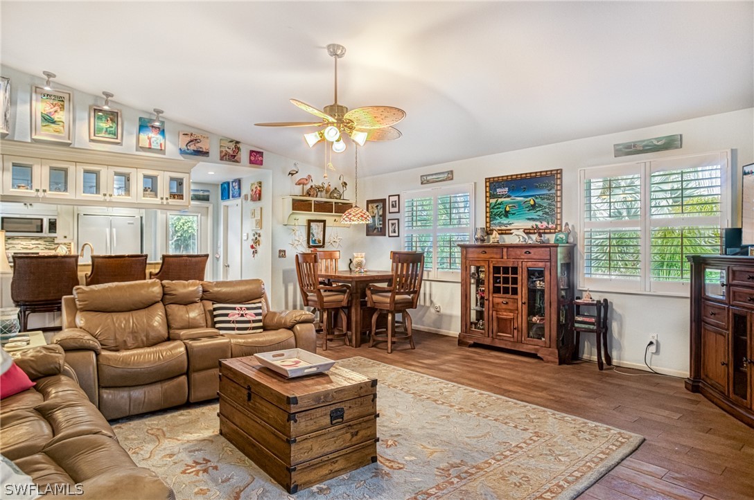 1186 Sand Castle Road Sanibel, FL 33957 - Photo 7 of 24 a living room with furniture and a chandelier