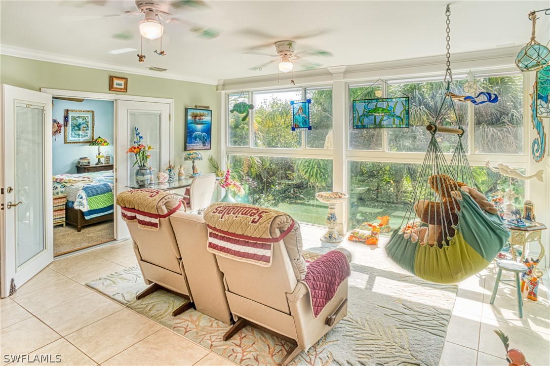 1186 Sand Castle Road Sanibel, FL 33957 - Photo 10 of 24 a living room with furniture and a large window