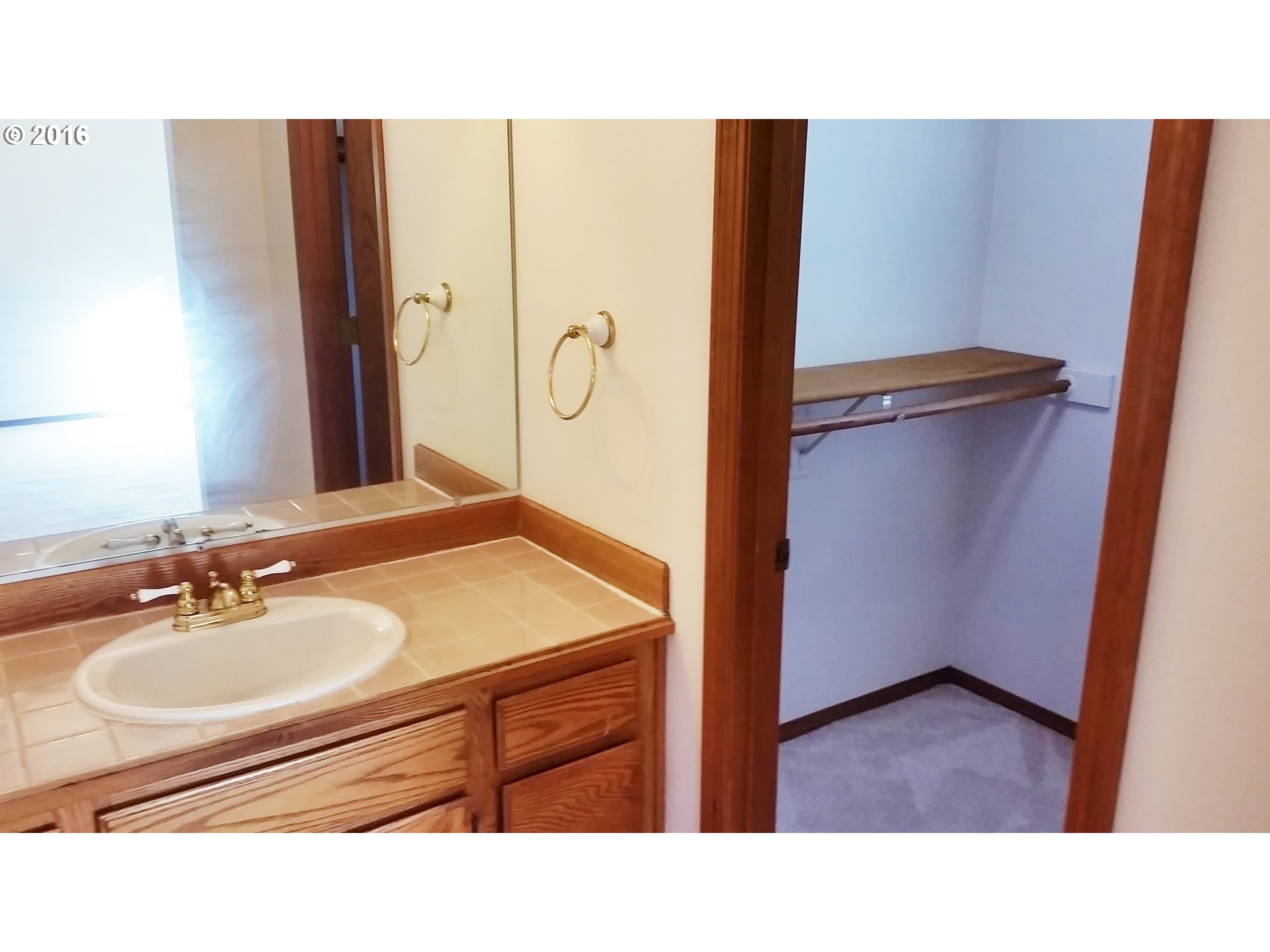 1173 Northwest Weybridge Way Beaverton, OR 97006 - Photo 11 of 12 a bathroom with a sink and a mirror
