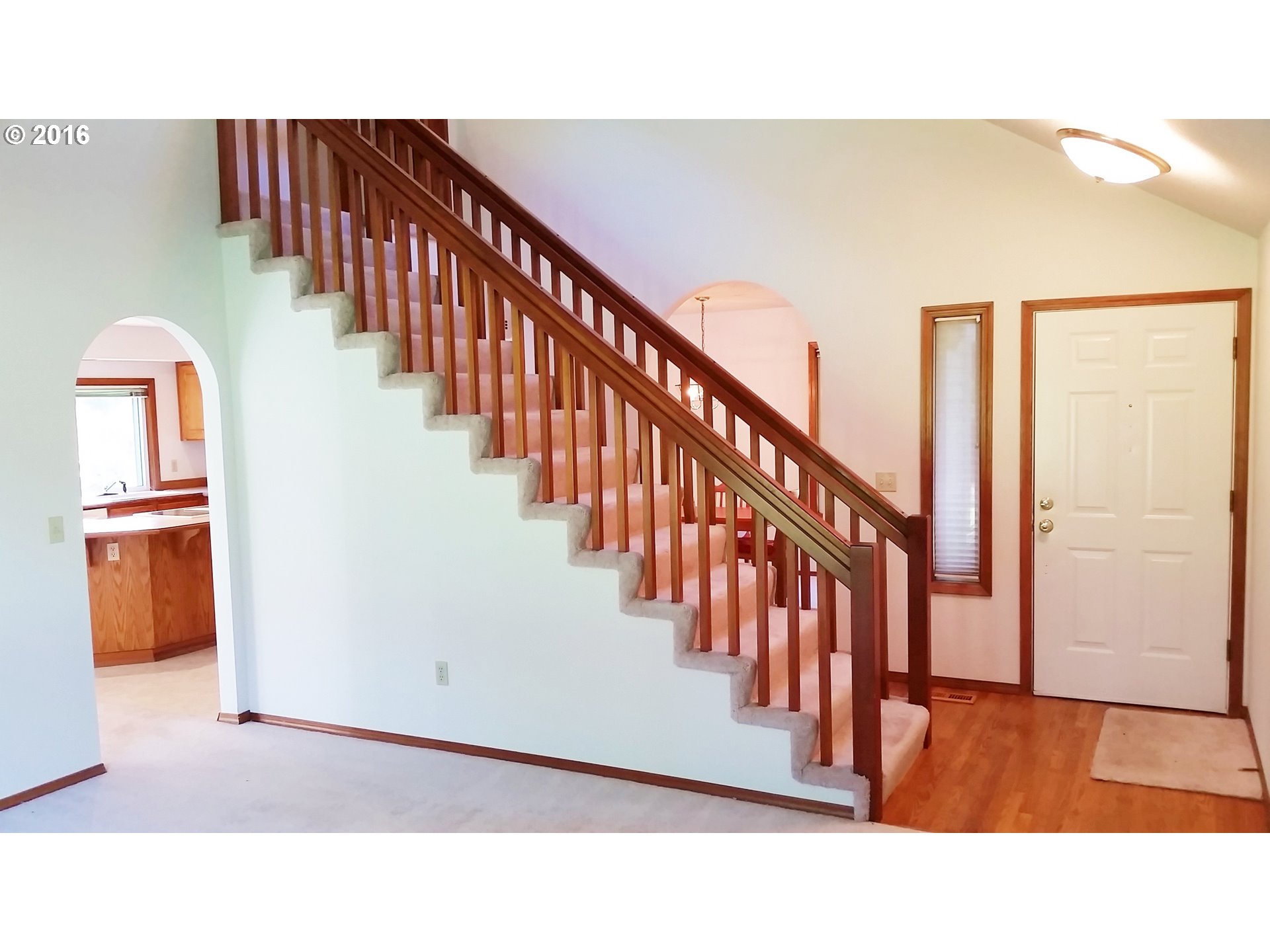 1173 Northwest Weybridge Way Beaverton, OR 97006 - Photo 2 of 12 a view interior of a house with wooden floor windows and stairs