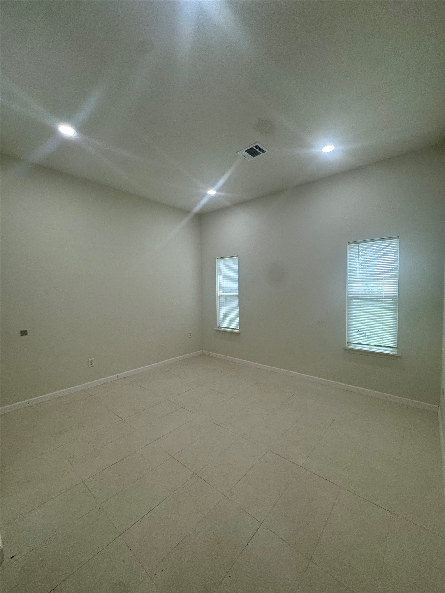1443 Willow Rock Road Houston, TX 77088 - Photo 15 of 27 an empty room with a empty space and windows