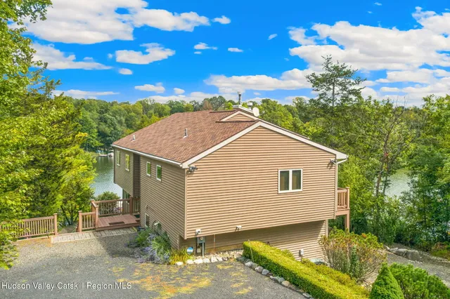 a view of a chairs and table in backyard