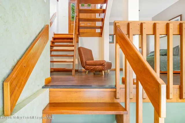 a view of a chair and table in the balcony