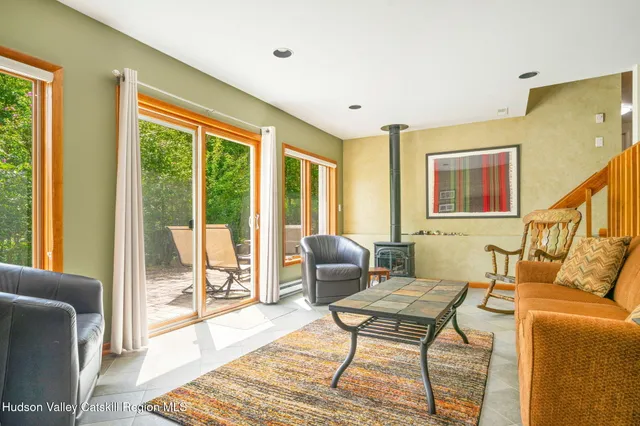 an aerial view of a house with a yard basket ball court and a fountain