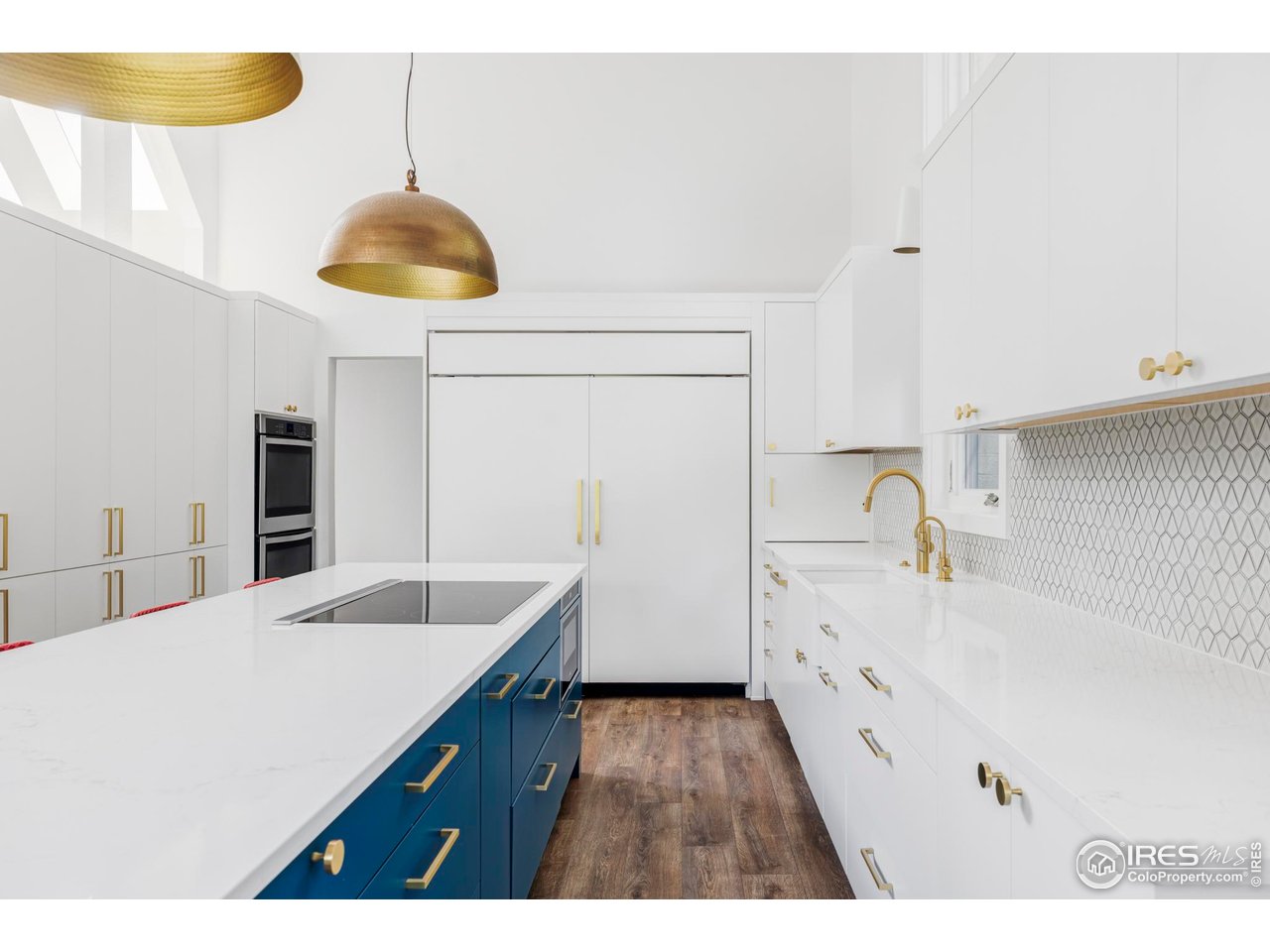 7306 Island Circle Boulder, CO 80301 - Photo 10 of 38 a kitchen with a wooden floor and a stove