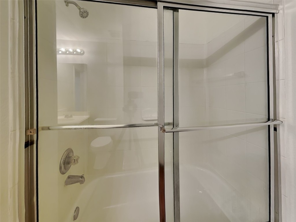 3555 Red Meadows Drive Spring, TX 77386 - Photo 12 of 15 a bathroom with a glass shower door
