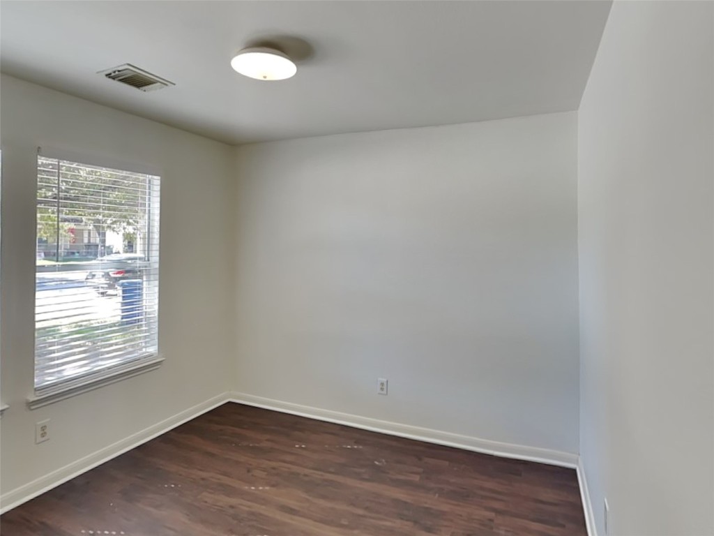 3555 Red Meadows Drive Spring, TX 77386 - Photo 9 of 15 an empty room with wooden floor and windows