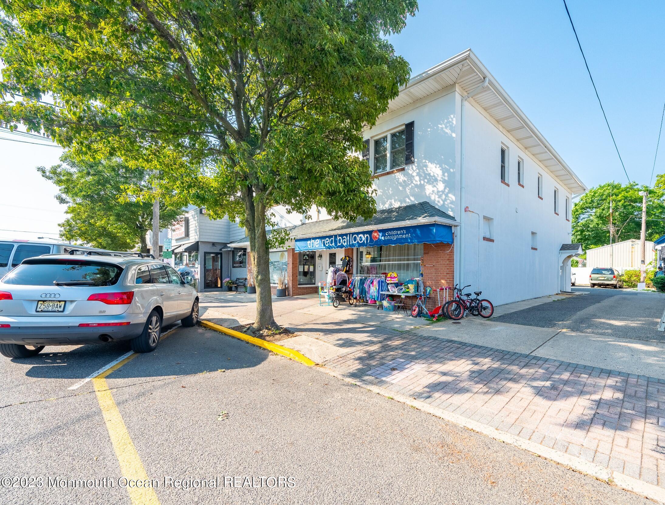 132 Main Street, Unit C Manasquan, NJ 08736 - Photo 1 of 28 a view of street with parked cars