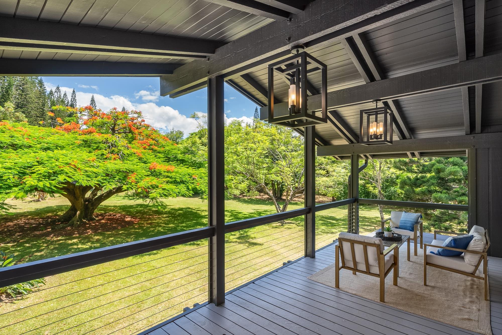 965 Hog Back Road Haiku, HI 96708 - Photo 24 of 44 a view of a porch with furniture and wooden floor