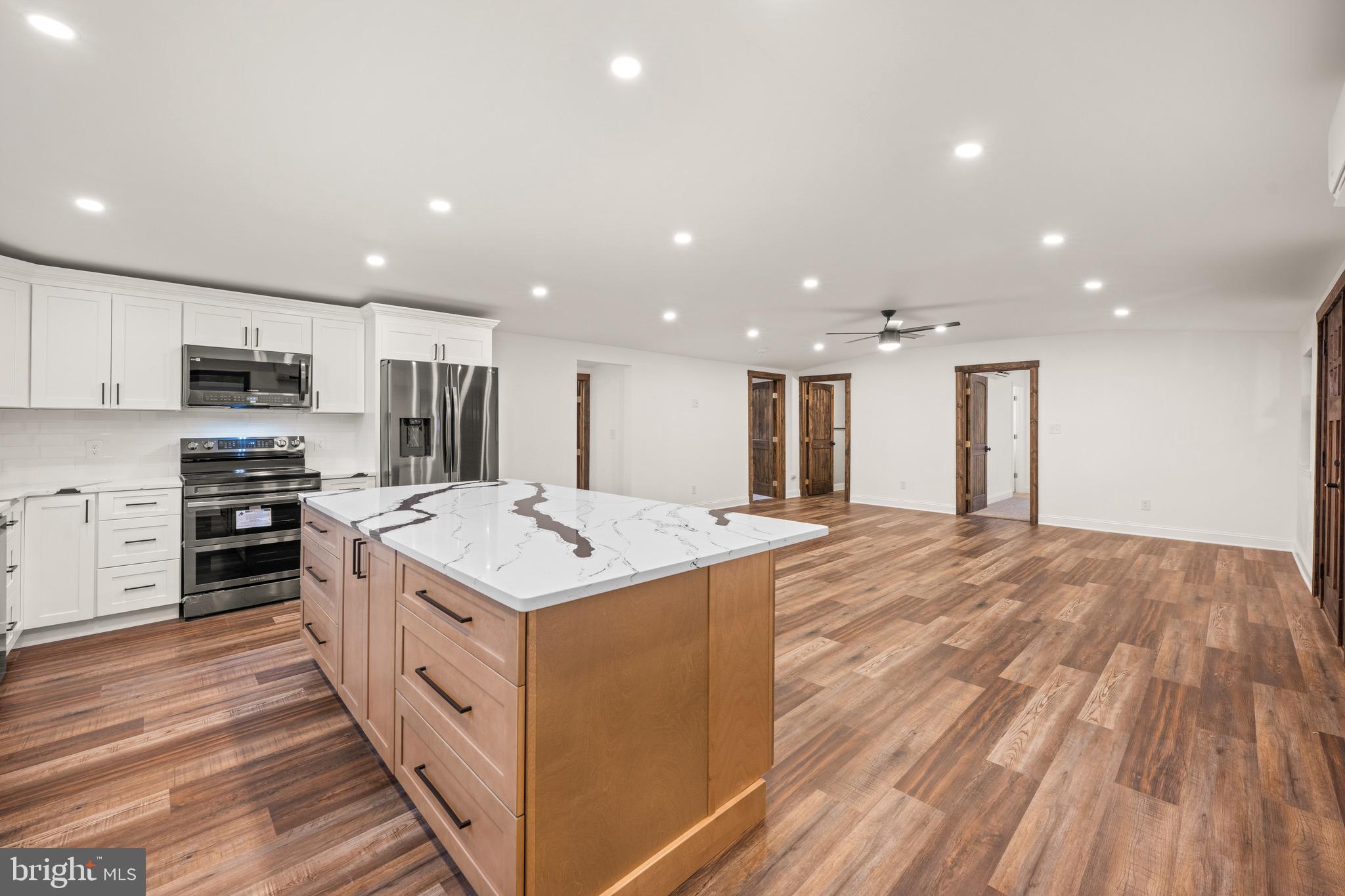 2 Schrier Avenue Salem, NJ 08079 - Photo 4 of 41 a kitchen with stainless steel appliances kitchen island sink refrigerator and stove