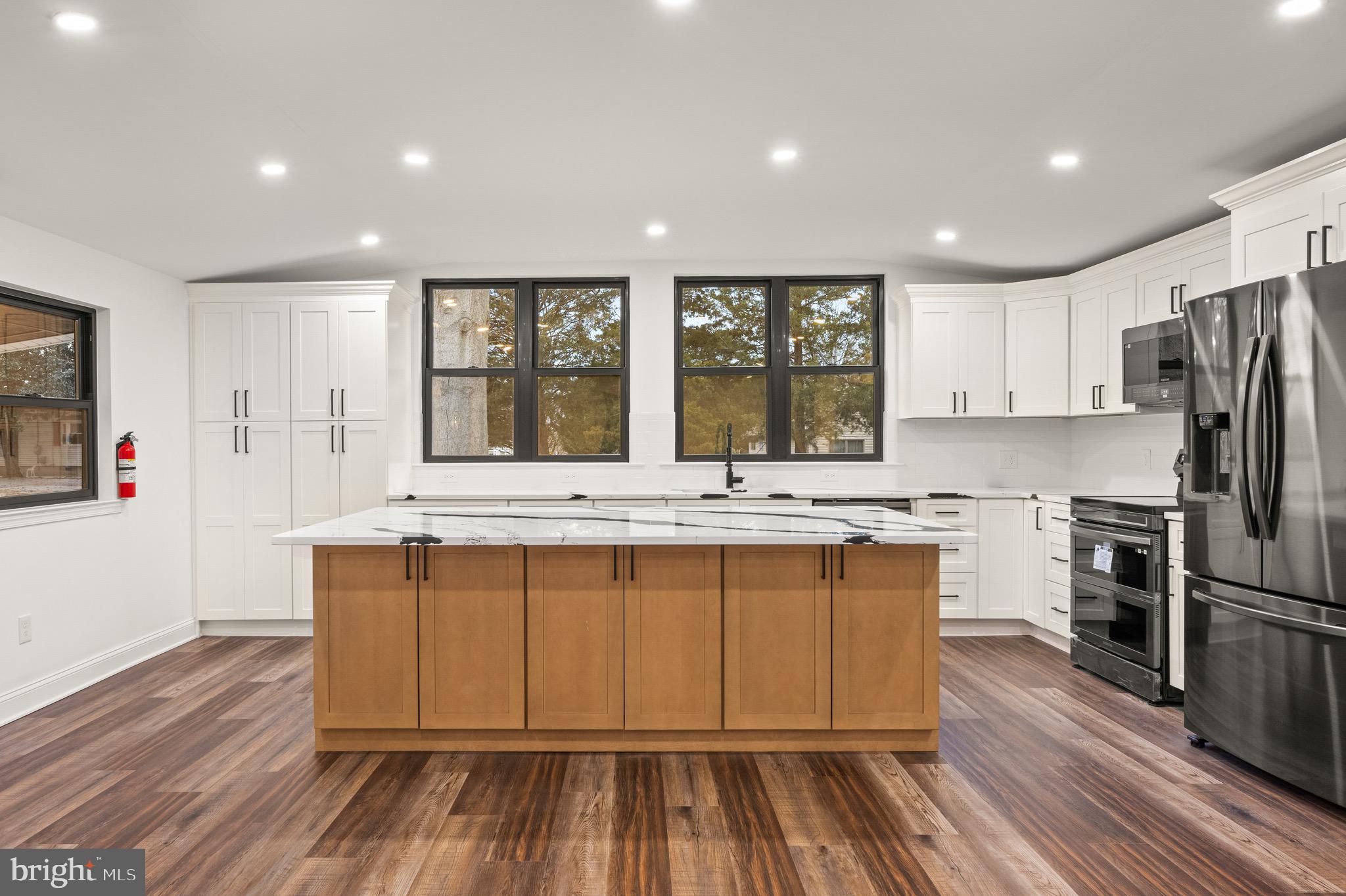 2 Schrier Avenue Salem, NJ 08079 - Photo 5 of 41 a large kitchen with wooden floor and stainless steel appliances