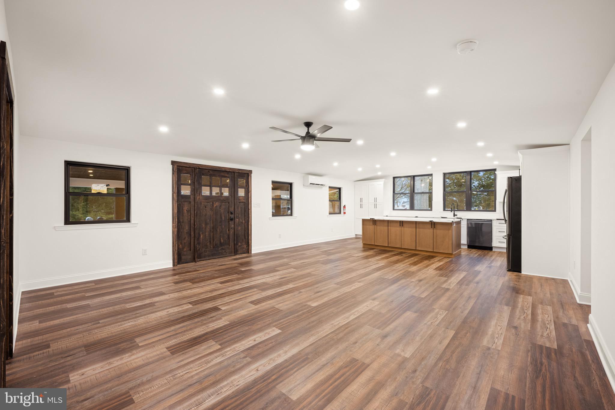 2 Schrier Avenue Salem, NJ 08079 - Photo 9 of 41 a view of an empty room with wooden floor and windows