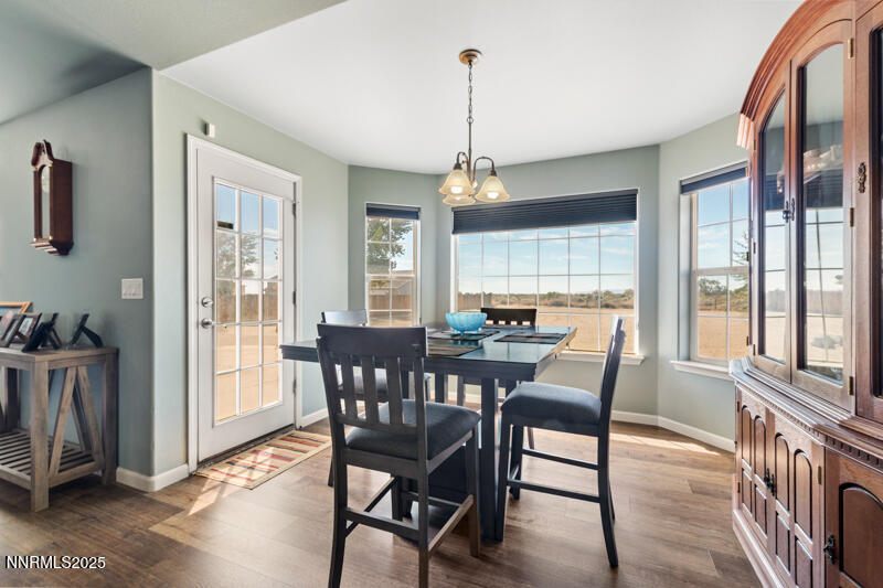 4609 Rancheria Road Fallon, NV 89406 - Photo 13 of 25 a view of a dining room with furniture window and wooden floor