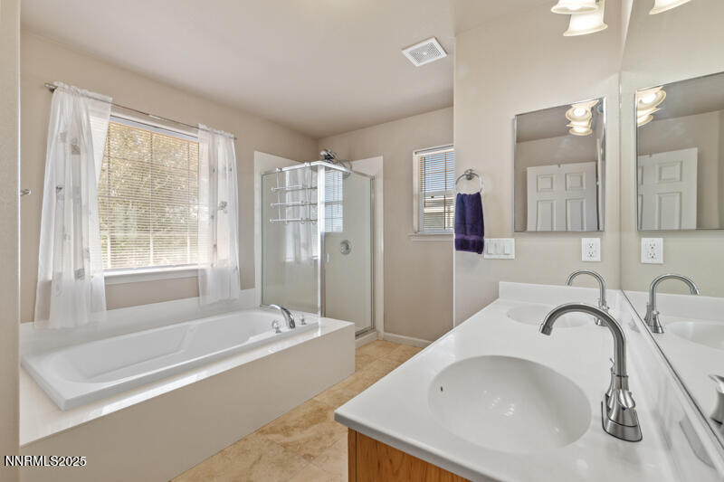 4609 Rancheria Road Fallon, NV 89406 - Photo 15 of 25 a bathroom with a bathtub and a sink