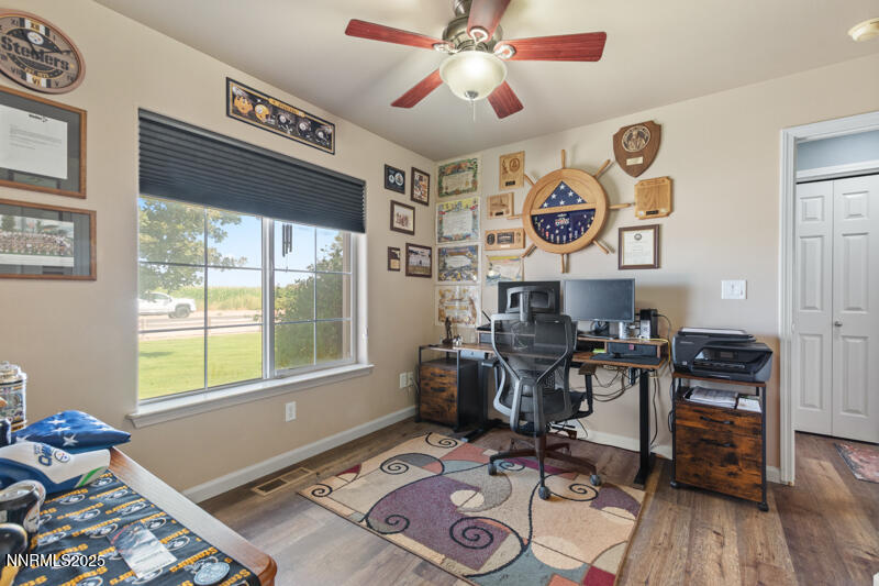 4609 Rancheria Road Fallon, NV 89406 - Photo 18 of 25 a work room with furniture and wooden floor