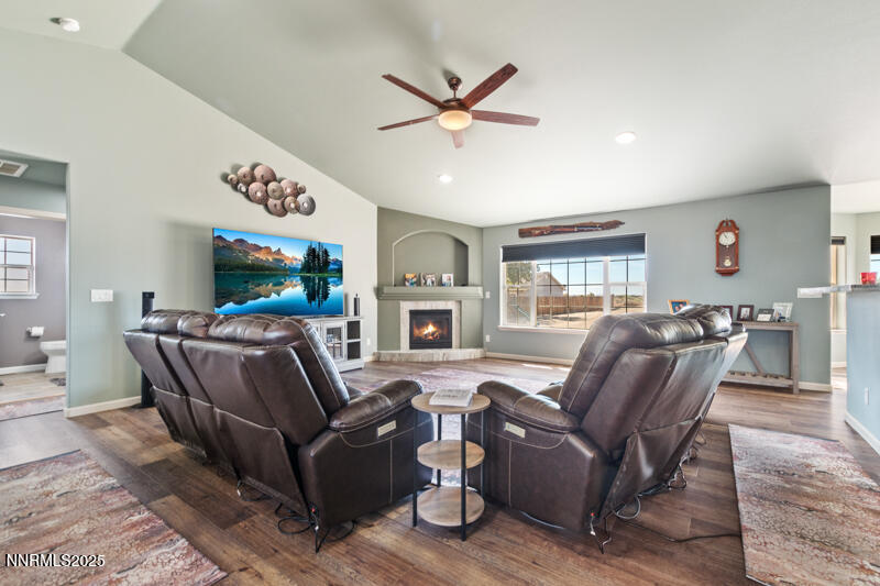 4609 Rancheria Road Fallon, NV 89406 - Photo 7 of 25 a living room with furniture a fireplace and a flat screen tv