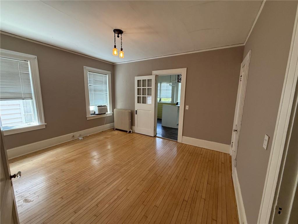 846 Briarcliff Road Northeast Atlanta, GA 30306 - Photo 7 of 22 an empty room with wooden floor and windows