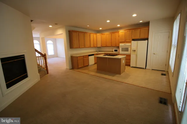 a view of a room with chandelier and entryway