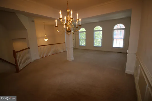a view of a livingroom and a hallway