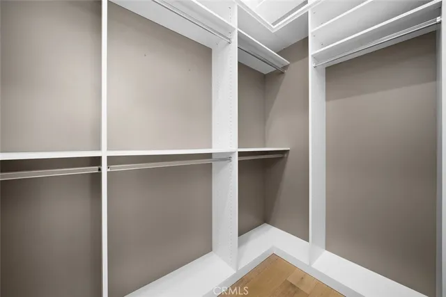 a bedroom with a large bed and a large window