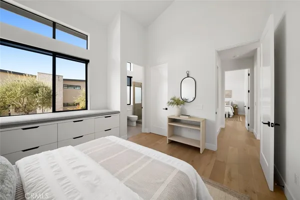 a spacious bathroom with a double vanity sink a mirror and a bathtub