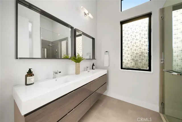 a bathroom with a sink and a large mirror