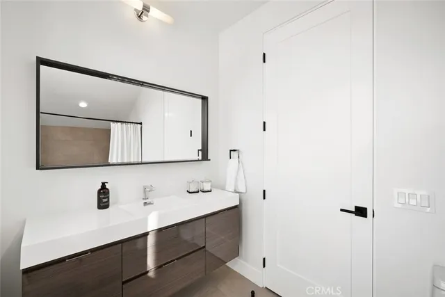 a bedroom with a bed and dresser