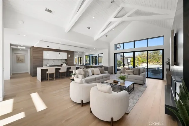 a view of a swimming pool with outdoor seating