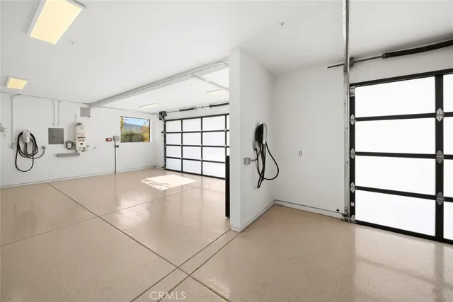 a building outdoor space with patio furniture and a potted plant