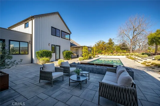 a view of swimming pool with chairs